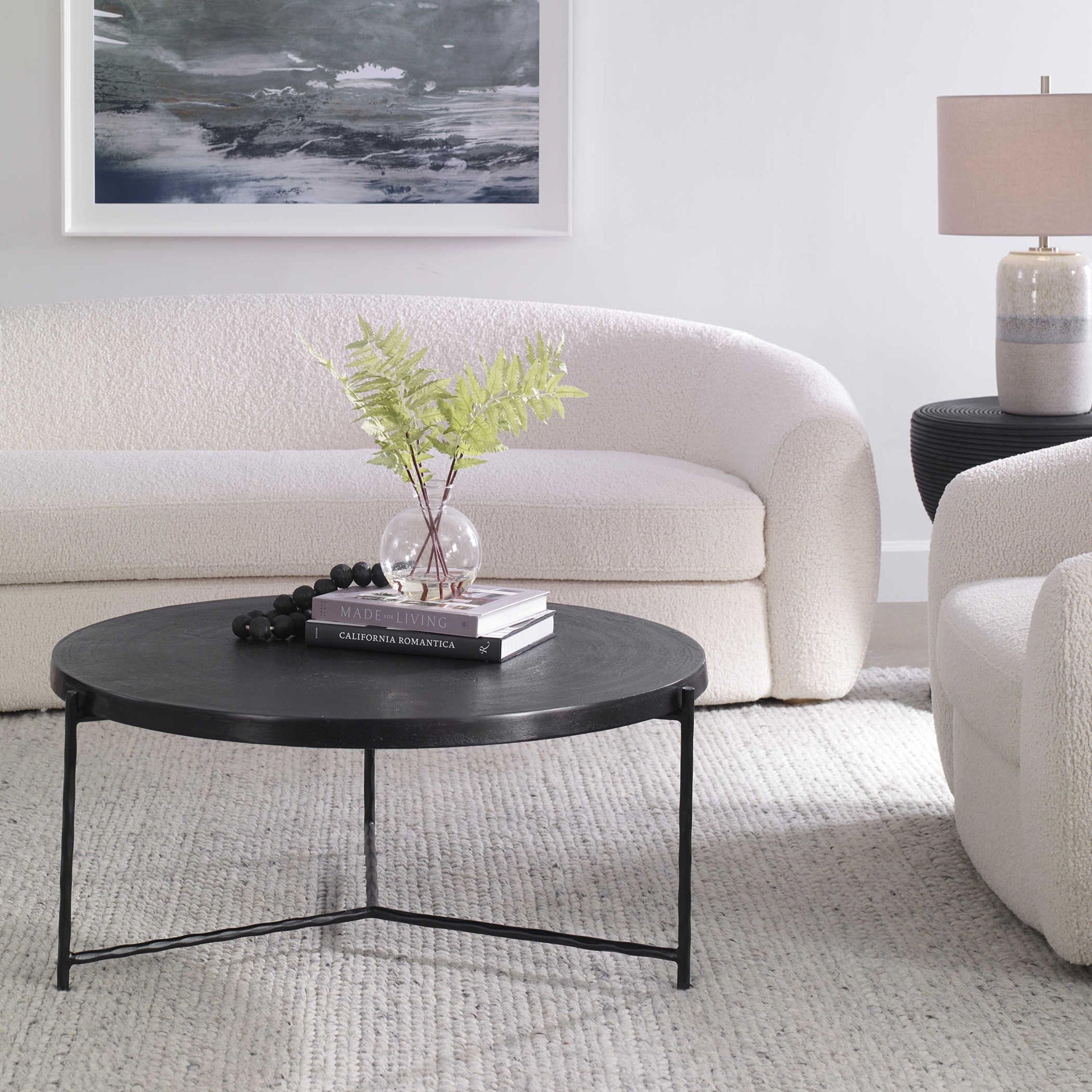 Uttermost Trellick Oxidized Black Top With Black Iron Base Modern Coffee Table - Image 1