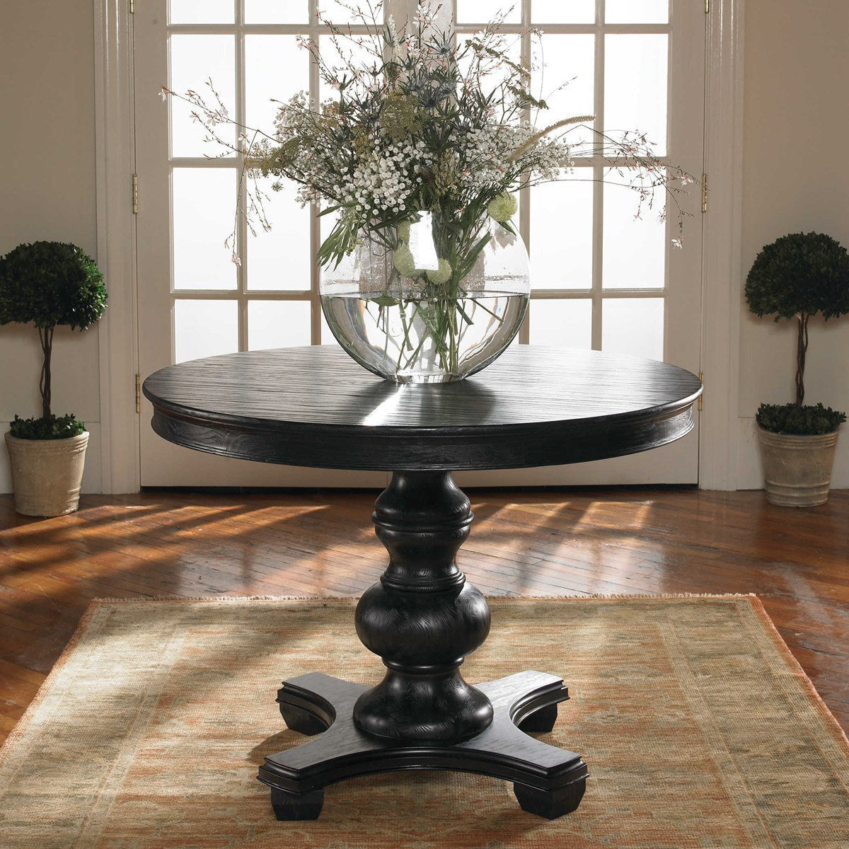 Uttermost Brynmore Black Wood 42” Round Dining Table - Image 1