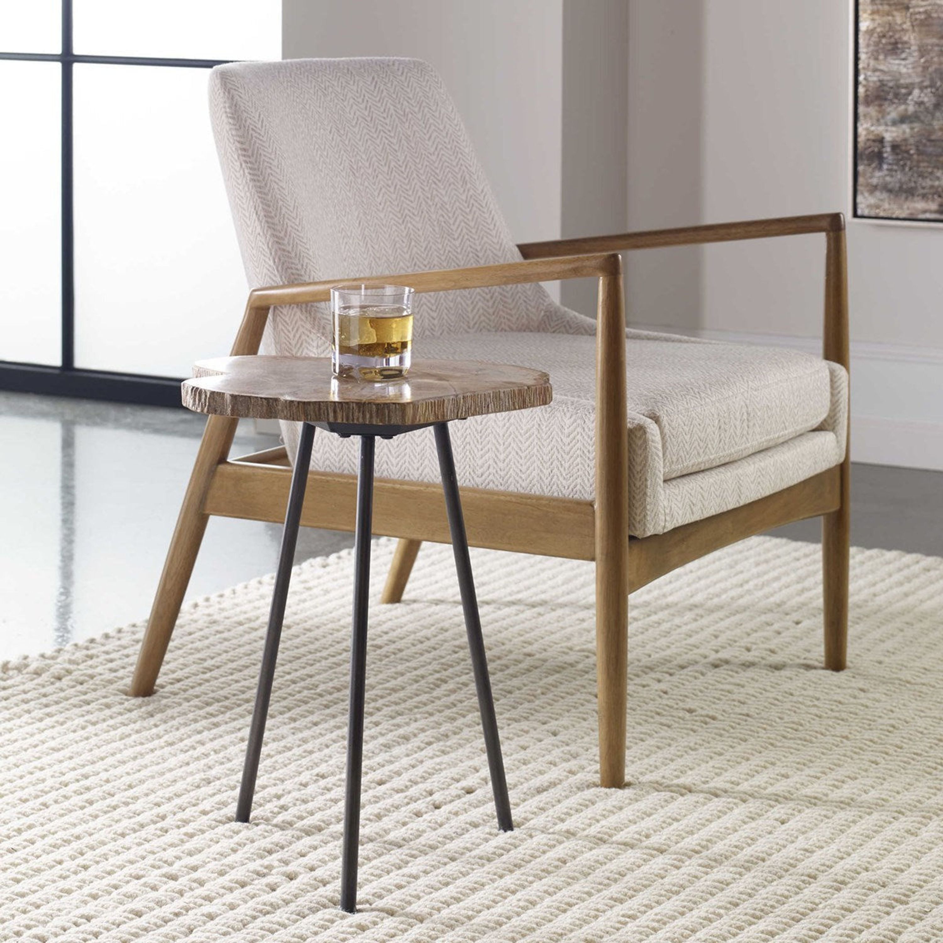Uttermost Mircea Natural Petrified Wood With Aged Black Iron Accent Table - Image 1