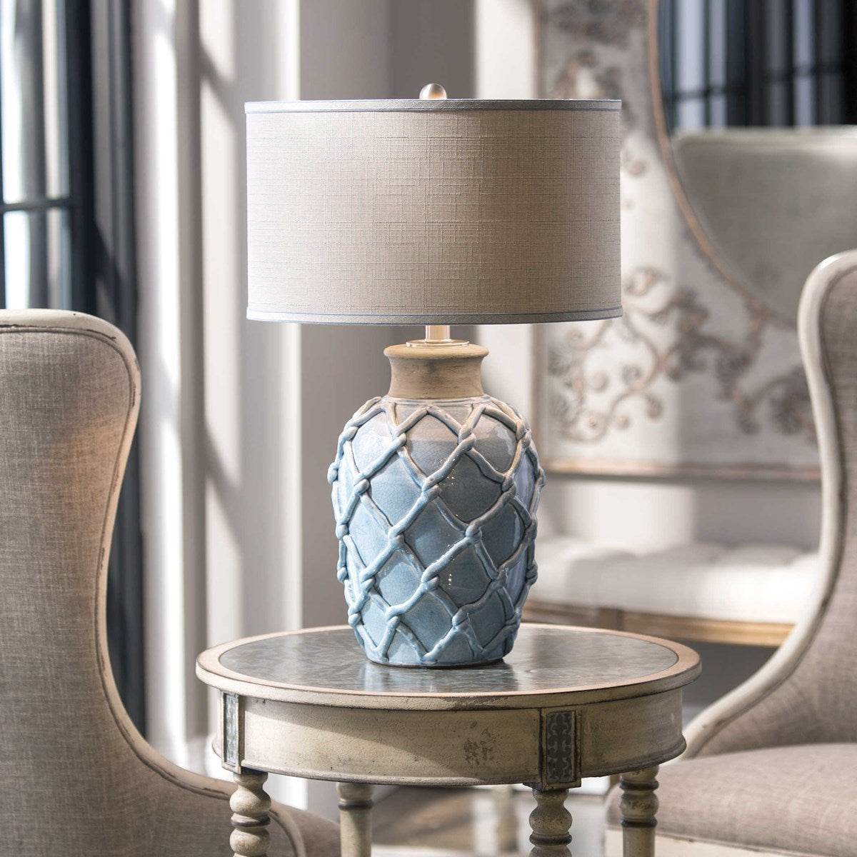Uttermost Parterre Pale Blue Ceramic Table Lamp With Light Beige Linen Shade - Image 1
