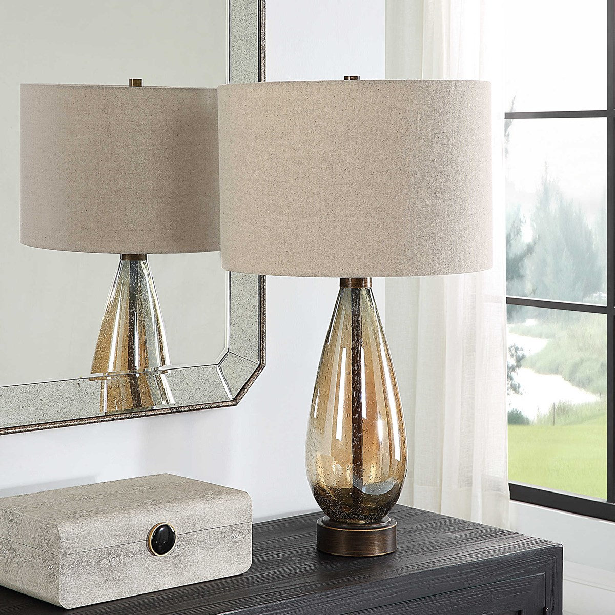 Uttermost Baltic Dark Amber Glass Table Lamp With Light Beige Linen Shade - Image 1