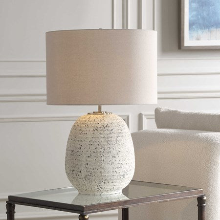 Uttermost Danala Distressed Stone Ivory Textured Ceramic Table Lamp With Light Beige Linen Shade - Image 1