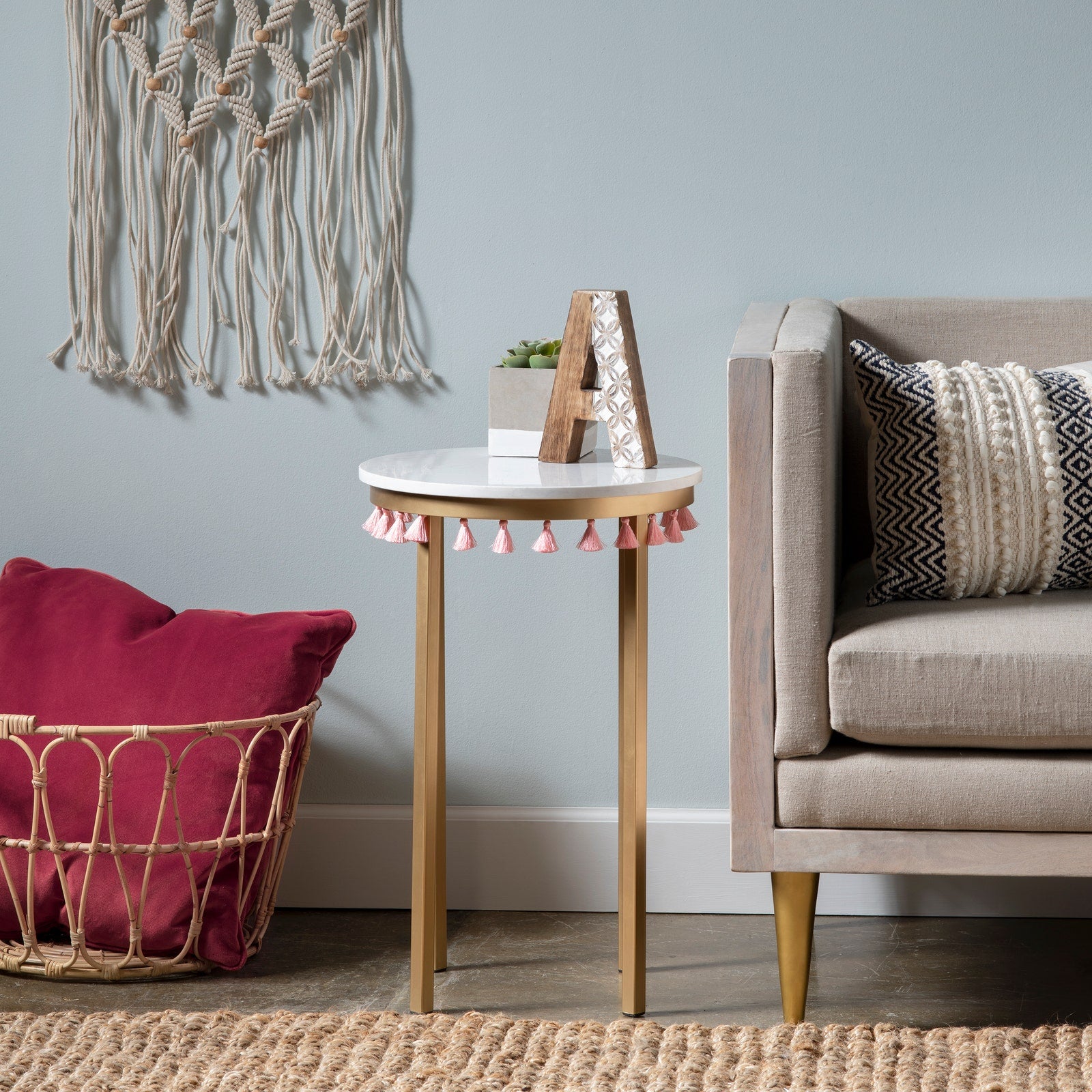 Crestview Collection Saffron Round Marble Accent Table With Pink Tassels - Image 1