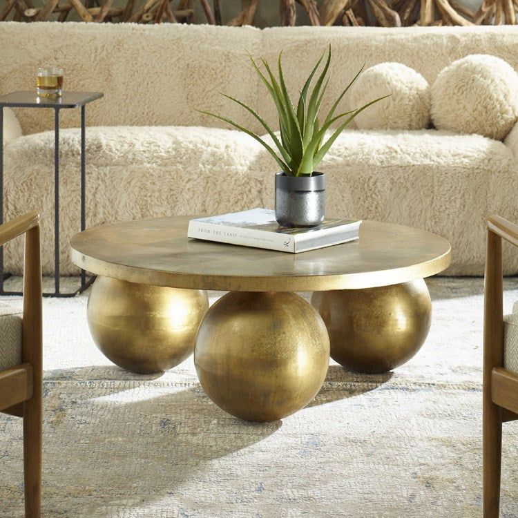 Uttermost Triplet Oversized Spheres Antique Brass Coffee Table - Image 1