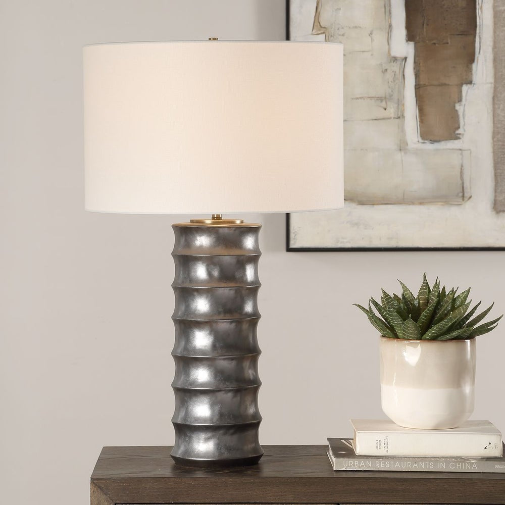 Uttermost Corvair Metallic Dark Bronze Glazed Base Table Lamp With White Linen Drum Shade - Image 1