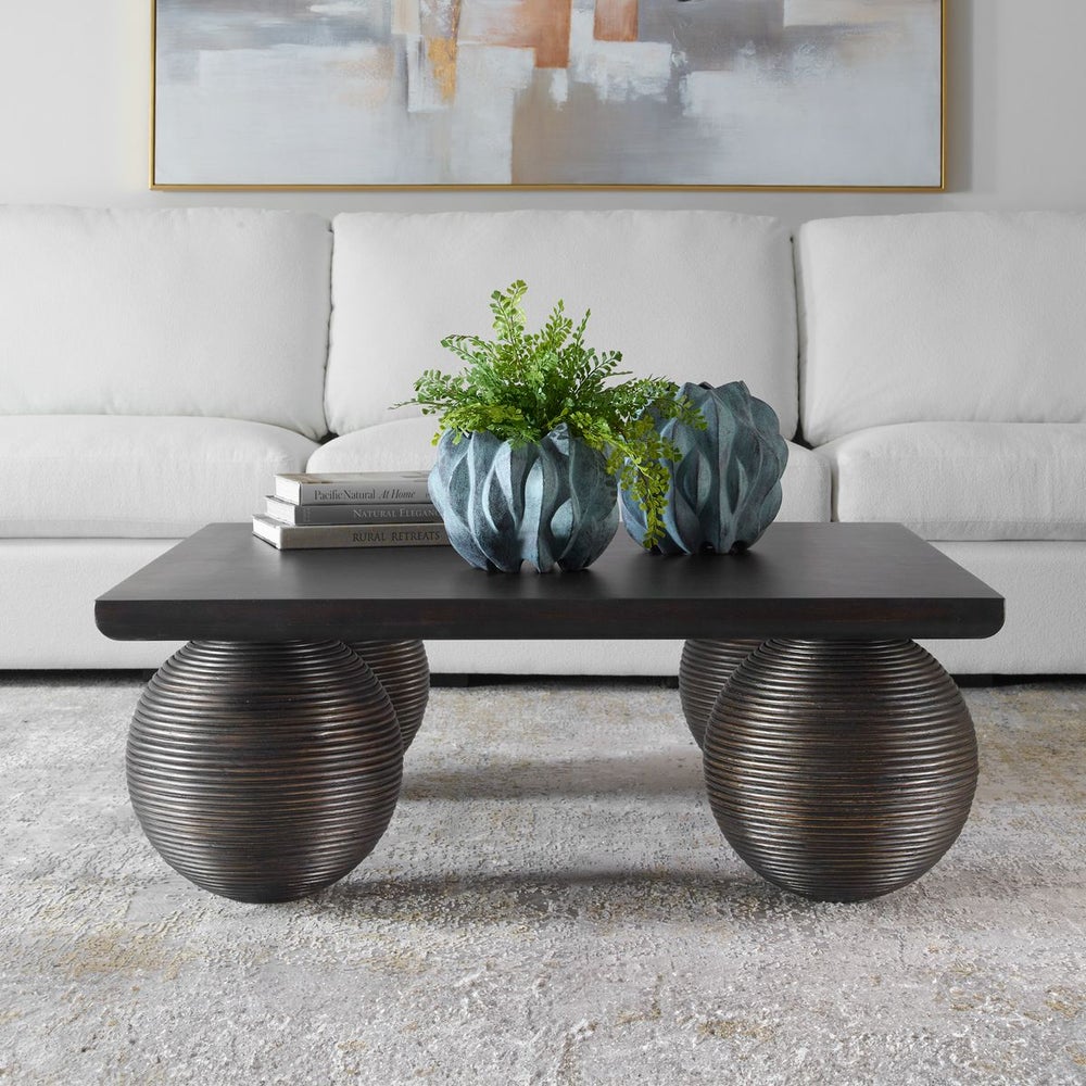 Uttermost Kasson Distressed Black Mango Wood and Rattan Coffee Table - Image 1