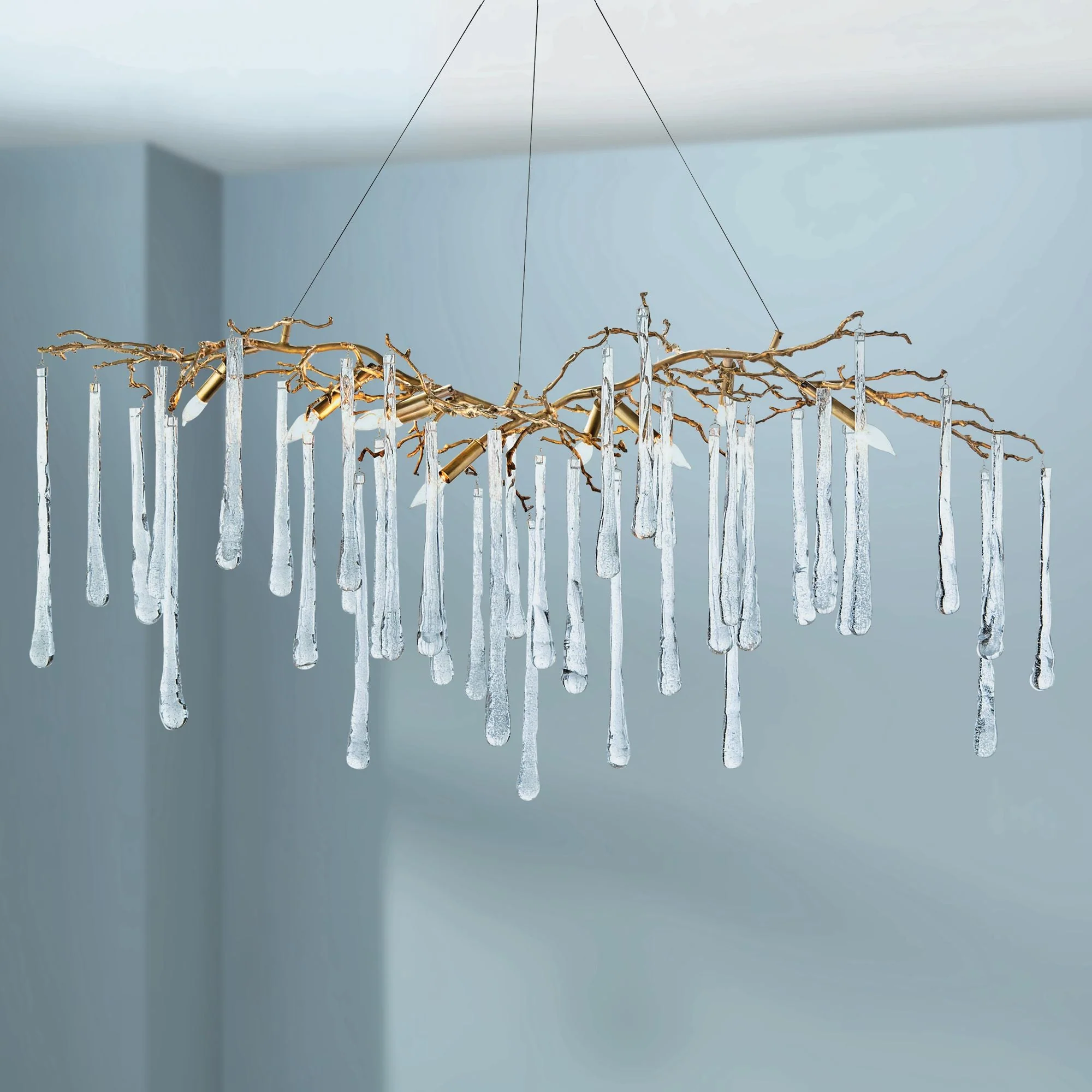 Brass and Glass Teardrop 60" Wide 9-Light Island Chandelier - Image 1